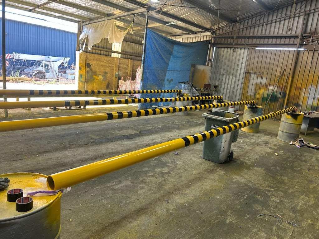 Impact safety bollards fabricated and coated on trestles